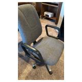 Office chair with handles located in basement