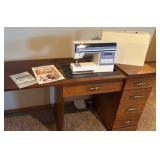 Husqvarna Viking 400 computer sewing machine, cover and sewing cabinet and accessories 30x70x20.5 fully extended located in basement