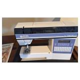 Husqvarna Viking 400 computer sewing machine, cover and sewing cabinet and accessories 30x70x20.5 fully extended located in basement