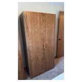 2 door armoire 72x26x20 located in basement