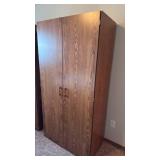 2 door armoire 72x26x20 located in basement