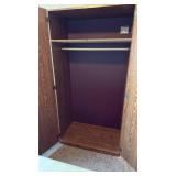 2 door armoire 72x26x20 located in basement