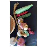 Wood bowl with ceramic fruit on rope