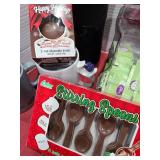 Chocolate stirring spoons, cocoa bombs, Stevia, mugs.