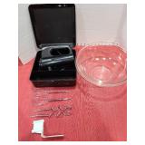 Hand mixer in case and a large mixing bowl.