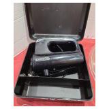 Hand mixer in case and a large mixing bowl.