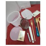 Tupperware, utensils, recipe cards.