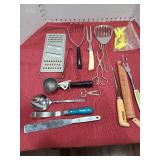 Fish filet knife with case and other kitchen utensils.