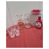 Pitchers, glasses, strawberry syrup.