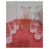 Pitchers, glasses, strawberry syrup.