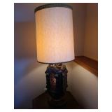 Spanish revival style table lamp in wood with plastic amber panels, lighting in upper and lower sections, 46in tall
