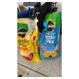 Miracle Gro potting mix one 1/4 and one 1/2 full