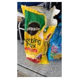 Miracle Gro potting mix one 1/4 and one 1/2 full