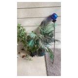 Faux plants and small gazing ball