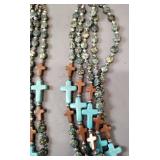 multi-strand beaded necklace with turquoise and wood crosses, paired with a copper brass cuff bracelet.