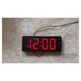 Digital LED Display Clock with Red Numbers (approximately 11 inches by 3 inches)