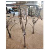 WROUGHT IRON DINING TABLE with a GLASS TOP and FOUR CHAIRS