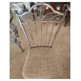 WROUGHT IRON DINING TABLE with a GLASS TOP and FOUR CHAIRS