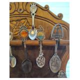 COLLECTION OF SOUVENIR SPOONS AND WOOD SPOON HOLDER