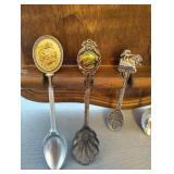 COLLECTION OF SOUVENIR SPOONS AND WOOD SPOON HOLDER