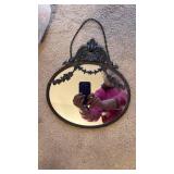 Ornate Black Plastic Framed Oval Wall Mirror with Chain (approximately 10 inches diameter)