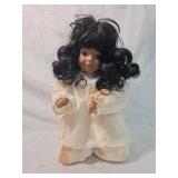 Porcelain Doll with Black Hair and White Dress