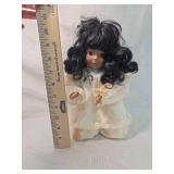 Porcelain Doll with Black Hair and White Dress