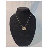 Gold Tone Necklace with Triple Ring Pendant