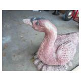 Large pinkish outdoor concrete goose decor