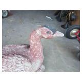 Large pinkish outdoor concrete goose decor