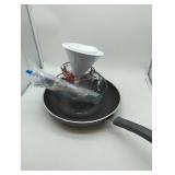 Multiple cooking items, see lot images. Anchor Hocking Glass Measuring Cup Set of 2, 10 1/2 inch wide skillet, 1 set silverware, 3 funnels, & 1 glass 7 cup microwave safe glass bowl. Used, as is.