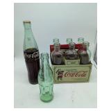 Coca-Cola Holiday 1899 Edition 6-Pack with Carrier, 1 coke bottle Austin TX, 1 coke bottle San Francisco. 8 bottles total.