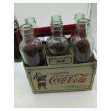 Coca-Cola Holiday 1899 Edition 6-Pack with Carrier, 1 coke bottle Austin TX, 1 coke bottle San Francisco. 8 bottles total.
