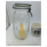 Various glassware & 2 mugs, including 1 Starbucks brand.