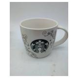 Various glassware & 2 mugs, including 1 Starbucks brand.