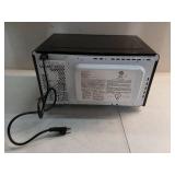Continental Electric.7 Cubic Feet Countertop Microwave in Black Glass Plate Included - Retail: $65
