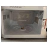 Continental Electric.7 Cubic Feet Countertop Microwave in Black Glass Plate Included - Retail: $65