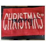 Red merry christmas couch cushion cover.Decorative red fabric banner with white text reading 