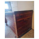 Red Cedar Storage Chest with Wooden Runners, 48 wide x 27 deep x 27 tall. Missing One Runner on Back and One Piece Front Corbel