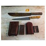 Knives with Wetting Stones in Leather Sheaths