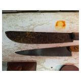 Knives with Wetting Stones in Leather Sheaths