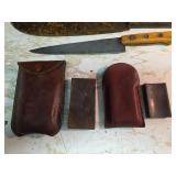Knives with Wetting Stones in Leather Sheaths