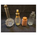 Collection of Glass Perfume Bottles and Pink Container