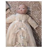 Antique Porcelain doll in pristine condition, gown has stunning eyelets and fine details