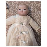 Antique Porcelain doll in pristine condition, gown has stunning eyelets and fine details