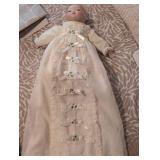 Antique Porcelain doll in pristine condition, gown has stunning eyelets and fine details