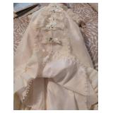 Antique Porcelain doll in pristine condition, gown has stunning eyelets and fine details