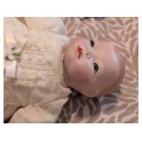 Antique Porcelain doll in pristine condition, gown has stunning eyelets and fine details