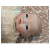 Antique Porcelain doll in pristine condition, gown has stunning eyelets and fine details