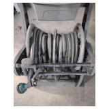 Plastic roll away garden hose